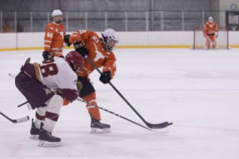 UT's Joe Kurita fights for the puck with Texas State's Luis Lopez in Friday's game.